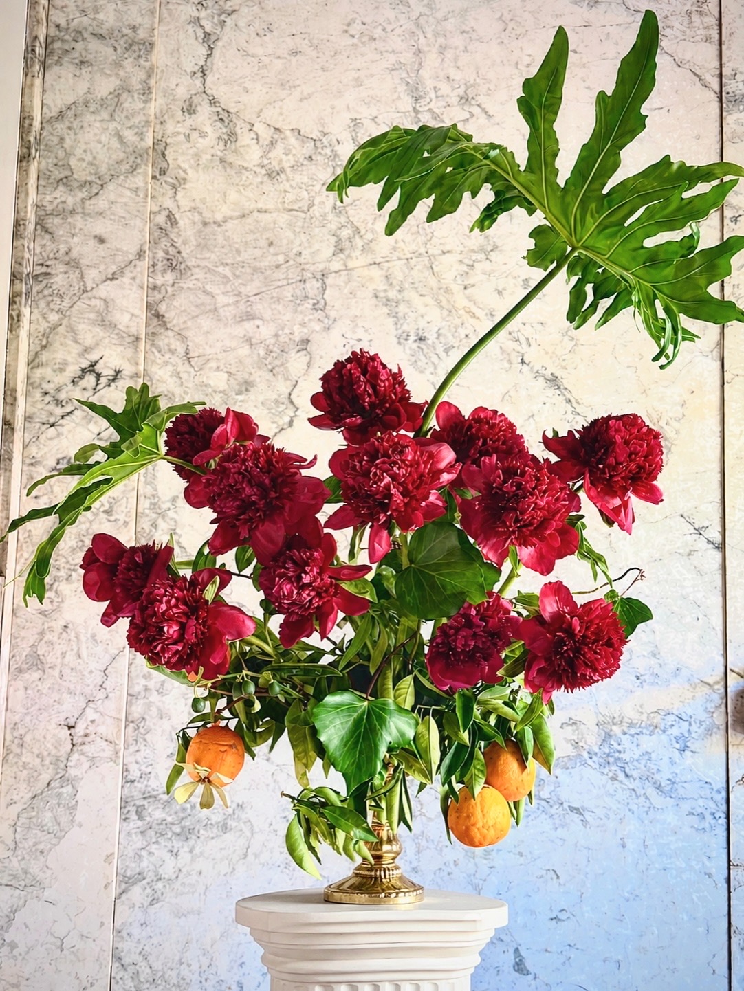 Hot pink peonies, purple delphinium, veronicastrum and fan palm — a statement piece for a Nob Hill lobby