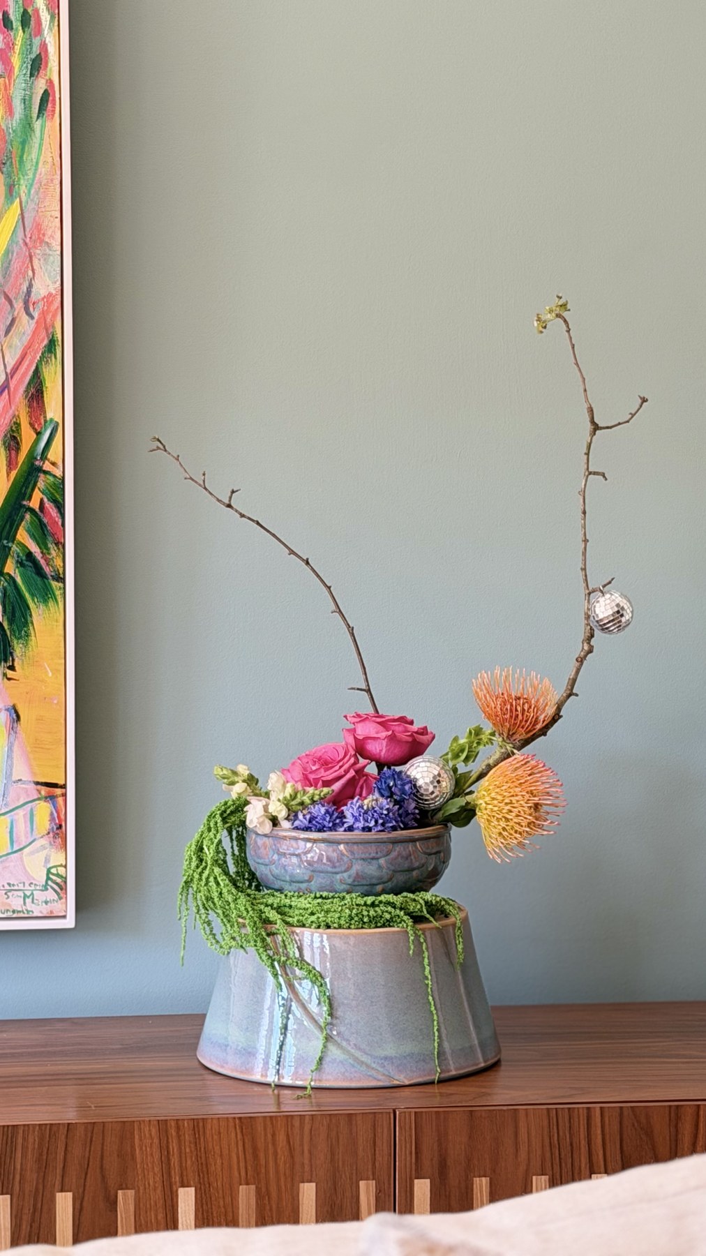 Companion arrangement — pincushion protea, hot pink roses, purple hyacinth with disco balls and trailing amaranthus