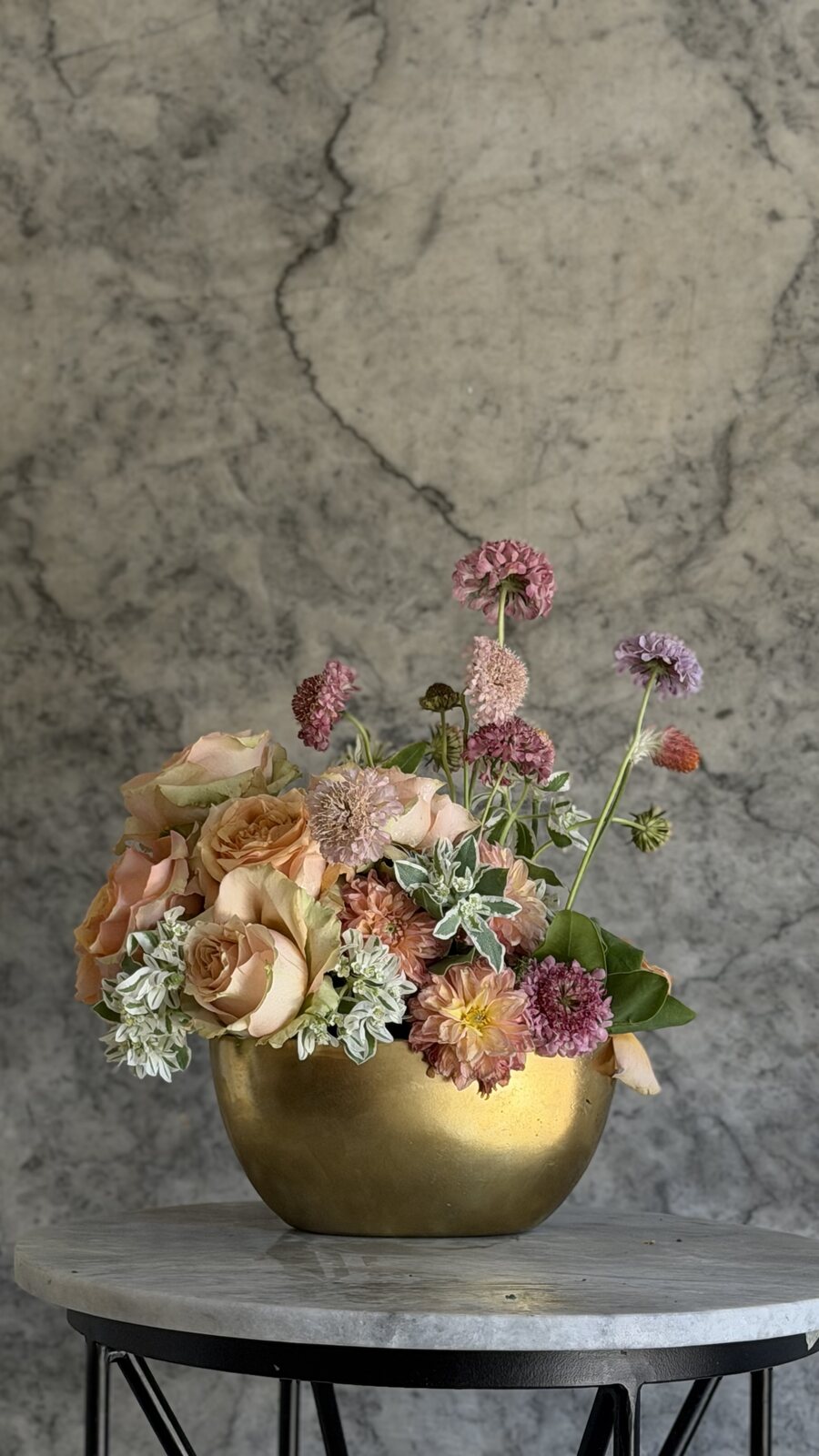 Textural flowers in a low seasonal arrangement