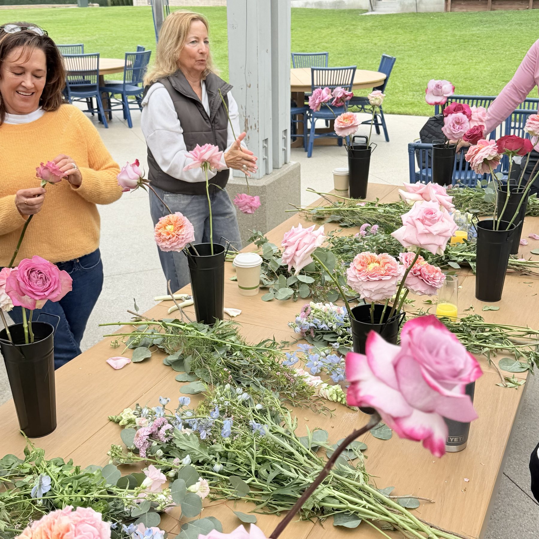 Guests making floral compositions together at a private atelier